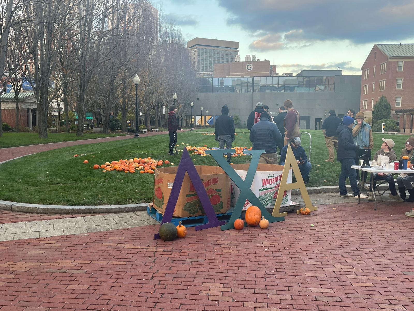 Lambda Chi's letters in front of their table