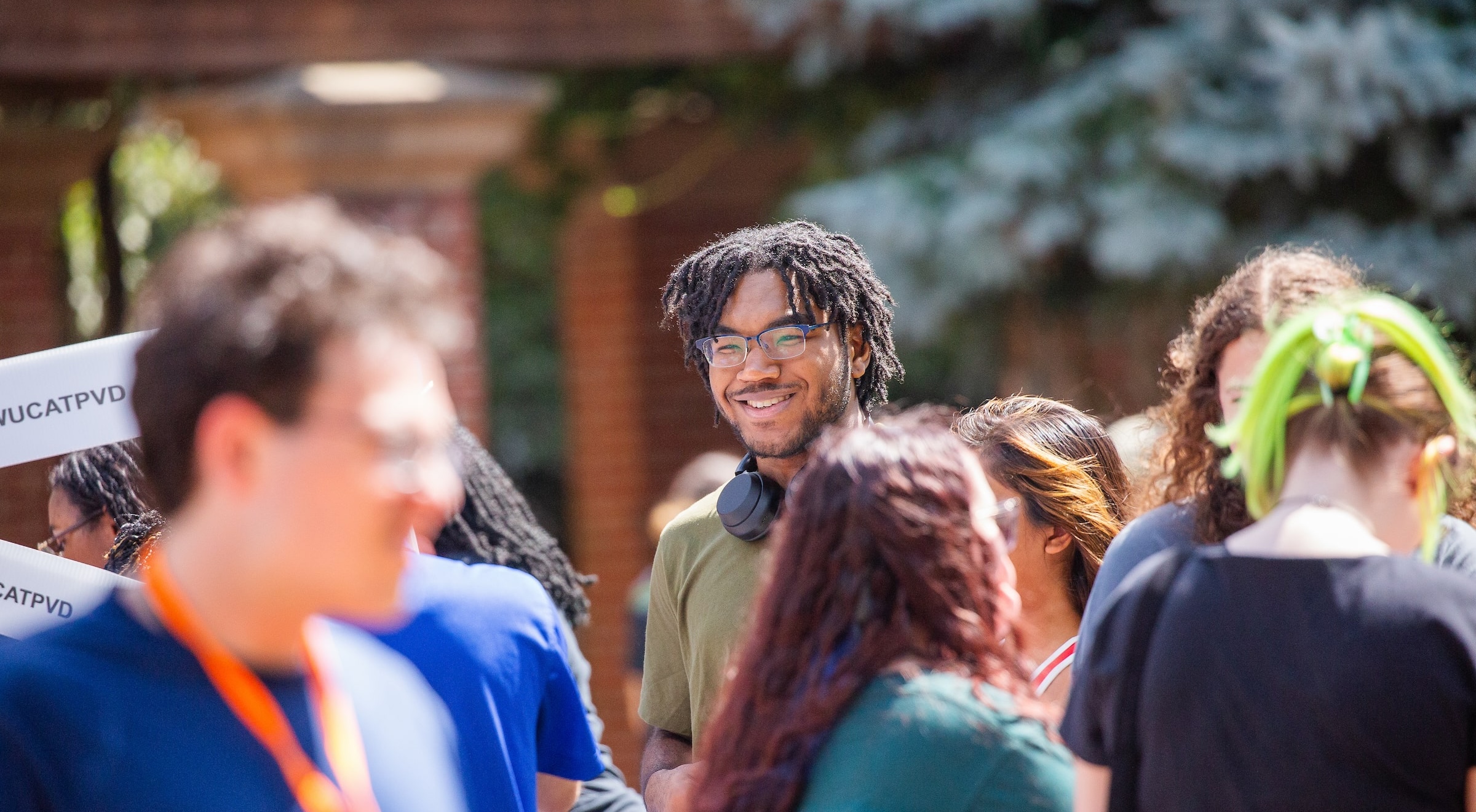 A smiling face in a sea of students at Involvement Fest at JWU