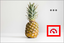 A pineapple with a red accessibility indicator dial in the bottom right. 